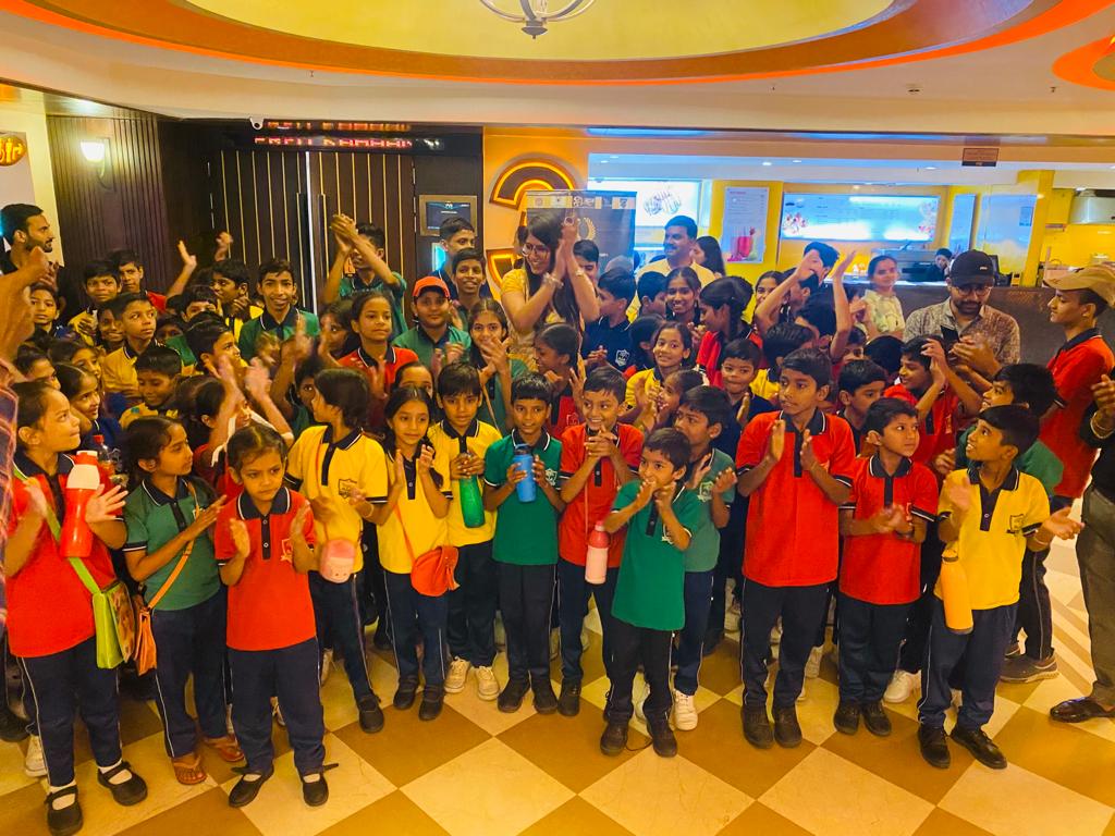 Children receiving education kits