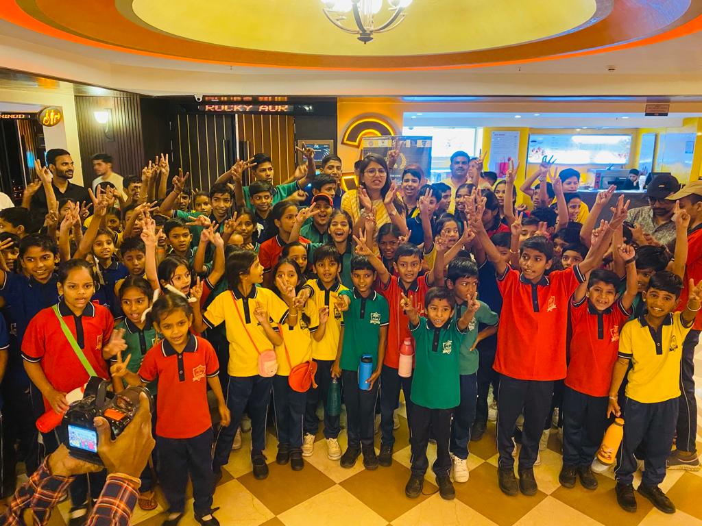 Children receiving education kits